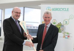 Professor Shane Ward, UCD School of Biosystems and Food Engineering, presents Phil Hogan, European Commissioner for Agriculture and Rural Development, with the AgroCycle hurley during the launch of the €8 million AgroCycle ‘circular economy’ project. 